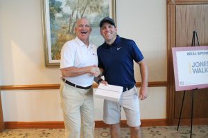 Dean of Engineering with a winner in a navy shirt