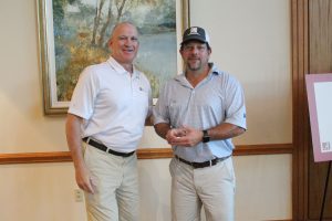 Dean of Engineering with a winner in a light grey shirt