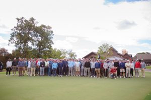 Group photo of all the golfers outside