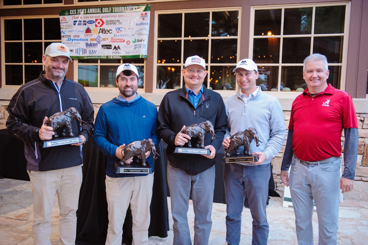 5 men with award statues of elephants with trunks down is second place (gross) winners